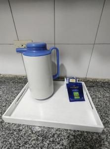 a blue and white cup on a tray on a counter at Vista sur in Buenos Aires
