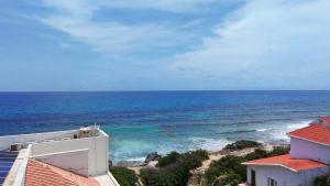 a view of the ocean from a building at Suites paty de Suites Rocio in Isla Mujeres