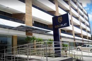 a building with a sign in front of it at Gold Flat by Nomar Hospedagem 610 in João Pessoa