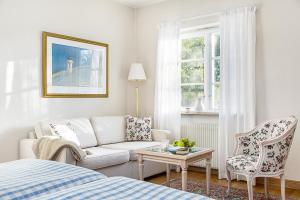 En eller flere senger på et rom på Hotell Gässlingen