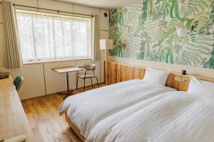 Postel nebo postele na pokoji v ubytování 那須パラダイスヴィレッジ Hotel PARADISO