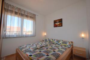 Postel nebo postele na pokoji v ubytování Apartment Jela