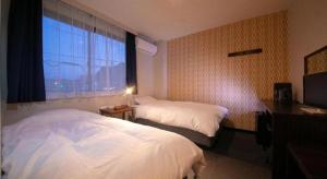 Postel nebo postele na pokoji v ubytování Personal Hotel You