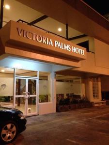 a building with a sign that reads victoria palms hotel at Victoria Palms Hotel in The Domain