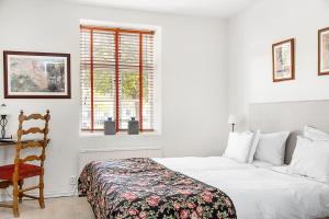 En eller flere senger på et rom på Hotell Gässlingen