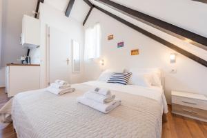Postel nebo postele na pokoji v ubytování Agata House Hvar