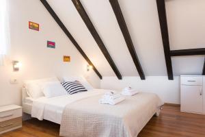Postel nebo postele na pokoji v ubytování Agata House Hvar