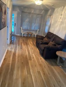 a living room with a couch and a table at Spacious 3 Bedroom , 1 Bath House Pet friendly in Red Top