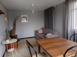 a living room with a couch and a table at casa carballal in Lorenzana