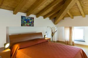 A bed or beds in a room at La Finestra Sul Golfo