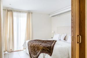 En eller flere senger på et rom på Hotell Gässlingen