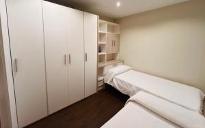 A bed or beds in a room at A Misericordia Viveiro