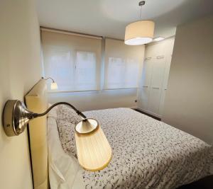 A bed or beds in a room at A Misericordia Viveiro