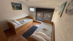Postel nebo postele na pokoji v ubytování Zigana Apartments