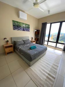 En eller flere senge i et værelse på Midhills Genting Highland + 5 billeder