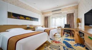TV a/nebo společenská místnost v ubytování Vienna Hotel Guangdong Zhuhai Mingzhu Station Guozheng