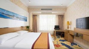 TV a/nebo společenská místnost v ubytování Vienna Hotel Guangdong Zhuhai Mingzhu Station Guozheng