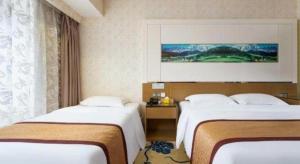Postel nebo postele na pokoji v ubytování Vienna Hotel Guangdong Zhuhai Mingzhu Station Guozheng