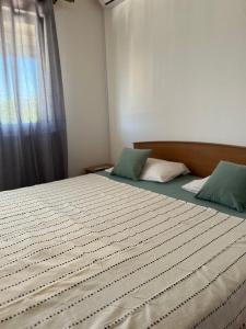 Postel nebo postele na pokoji v ubytování The Olive Tree