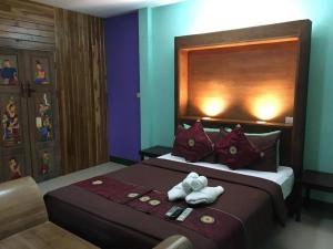 Postel nebo postele na pokoji v ubytování Ruen Kaew Resort + 47 fotografií