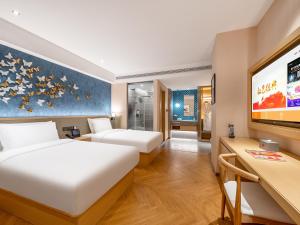 Beijing Chaoyang Park Crystal Orange Hotel房間的床