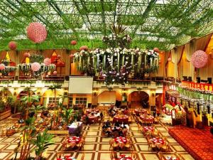 a large room with tables and chairs in a building at Nanning Yongjiang Hotel in Nanning