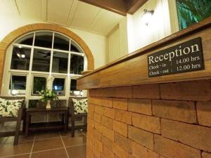 a restaurant sign in front of a building with a sign at Baan Pimpisa in Pattaya Central +160 photos