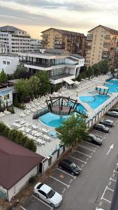 an overhead view of a parking lot with several swimming pools at Studio Alice Mia in Chiajna