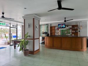 a lobby with a bar and a pool table at Emerald hotel in Jomtien Beach