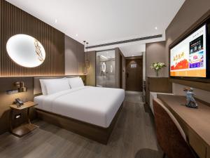Beijing Chaoyang Park Crystal Orange Hotel電視和／或娛樂中心