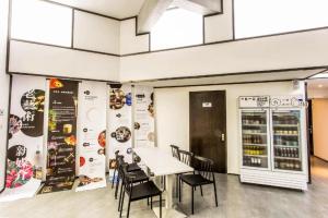 a dining room with a table and chairs at Together-Venue Fawn Hostel Suzhou in Suzhou
