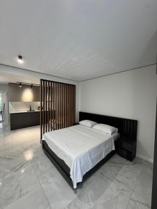 a bedroom with a large bed in a room at Nika house in Ureki