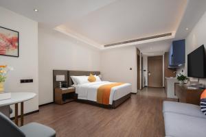 Letto o letti in una camera di Changsha Feiji Hotel