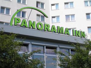 a sign on the front of a panoramic inn building at Panorama Inn Hotel in Hamburg