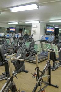 a gym with a bunch of exercise bikes in a room at El Tropicano Riverwalk in San Antonio