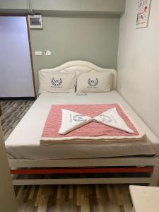 Postel nebo postele na pokoji v ubytování Miracle Gallery Hotel