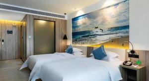 Un pat sau paturi într-o cameră la hailihotel