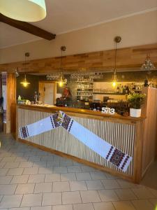 a bar with a christmas bow on the counter at Petite chatelaine in Herbeumont +11 photos