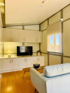 a living room with a couch and a table at Norwesta Lifestyle Park in Carnarvon