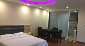 Ένα ή περισσότερα κρεβάτια σε δωμάτιο στο GreenTree Inn Wuhu Fangte Second Phase Nanxiang Wanshang Express Hotel
