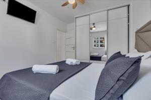 Posteľ alebo postele v izbe v ubytovaní Apartment San Marino