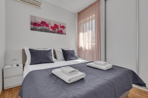 Posteľ alebo postele v izbe v ubytovaní Apartment San Marino