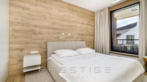 Łóżko lub łóżka w pokoju w obiekcie Prestige Apartments Botanica