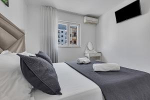 Posteľ alebo postele v izbe v ubytovaní Apartment San Marino