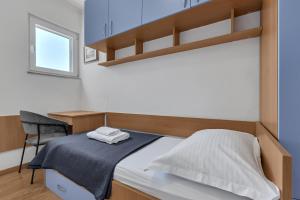Posteľ alebo postele v izbe v ubytovaní Apartment San Marino