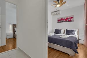 Posteľ alebo postele v izbe v ubytovaní Apartment San Marino
