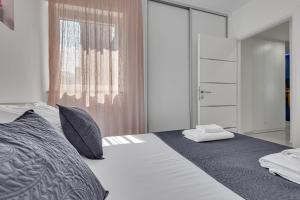 Posteľ alebo postele v izbe v ubytovaní Apartment San Marino