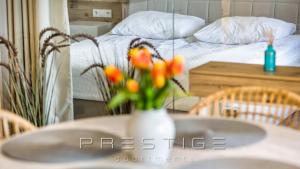 Łóżko lub łóżka w pokoju w obiekcie Prestige Apartments Botanica