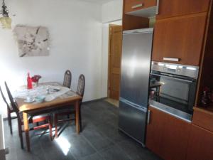 Kuchyň nebo kuchyňský kout v ubytování BSG Apartments