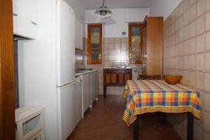 Kuchyň nebo kuchyňský kout v ubytování B&B La Bougainvillea